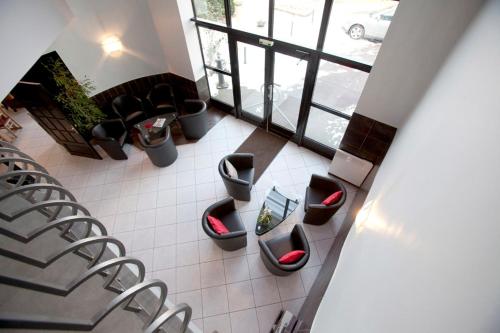 a room with a bunch of toilets in a building at Kyriad Limoges Sud - Feytiat in Feytiat