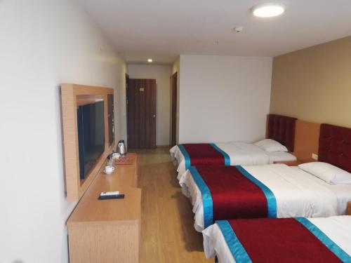 Postel nebo postele na pokoji v ubytování Bursa şahin hotel