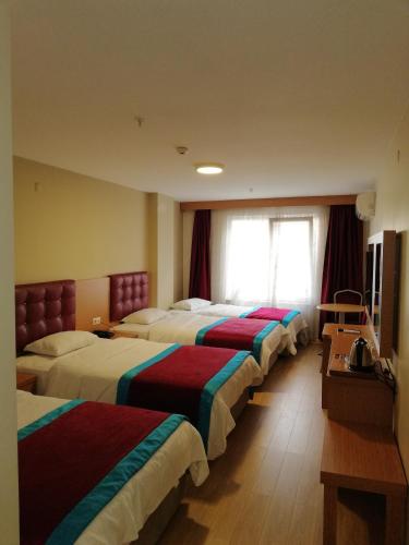 Postel nebo postele na pokoji v ubytování Bursa şahin hotel