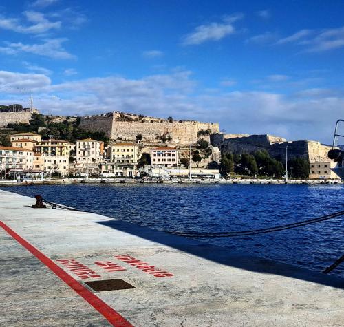 a large body of water with a city in the background at Loft Vista Mare Elba in Portoferraio