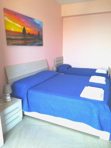 Katil atau katil-katil dalam bilik di B&B la spiaggetta di Stazzo