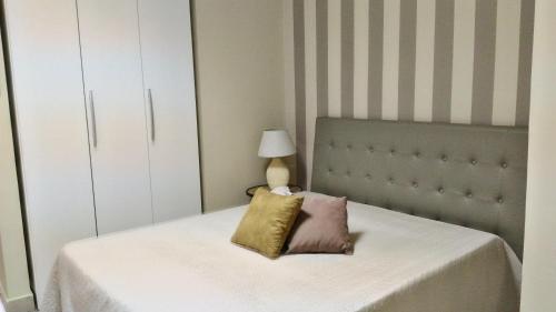 Ένα ή περισσότερα κρεβάτια σε δωμάτιο στο Hotel Sirio