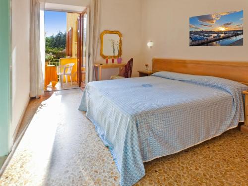 Postel nebo postele na pokoji v ubytování Hotel Cleopatra