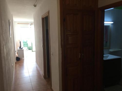 a room with a door and a hallway with a room with a hallway at costa del silencio 1 in Costa Del Silencio