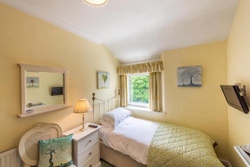 A bed or beds in a room at The Devonian 