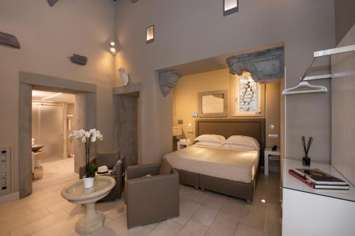 a bedroom with a bed and a bathroom at Antica Dimora Magi in Sorrento