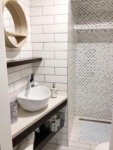 a white bathroom with a sink and a shower at Altana Mario in Piran