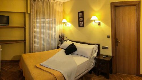 Postel nebo postele na pokoji v ubytování Hotel A Nieu
