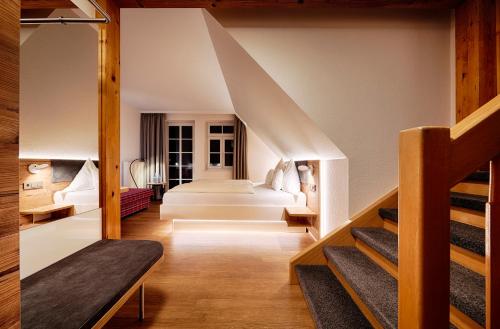 a room with stairs leading to a bedroom at Hotel Kronelamm im Schwarzwald in Bad Teinach-Zavelstein