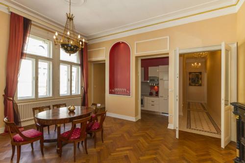a dining room with a table and chairs at Filip’s Palace Luxurious Apartment in Ljubljana