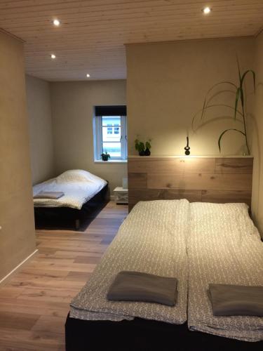 Un pat sau paturi într-o cameră la Billund Holiday - Assengaard B & B