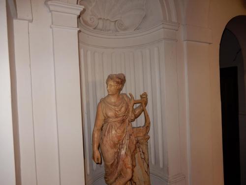 a statue of a woman standing next to a wall at Luciano And Son in Campobasso