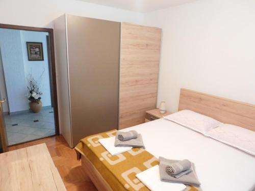 Postel nebo postele na pokoji v ubytování Apartment Krišković
