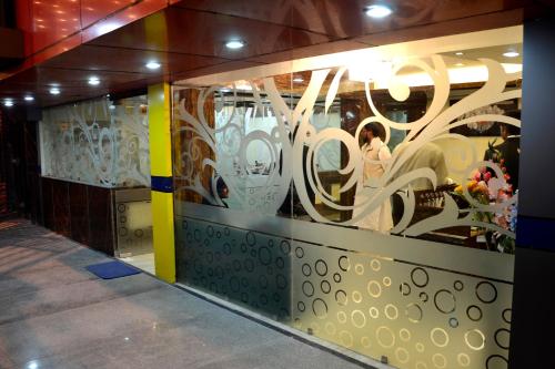 a display window of a store with vases at Hotel Saad in Kolkata