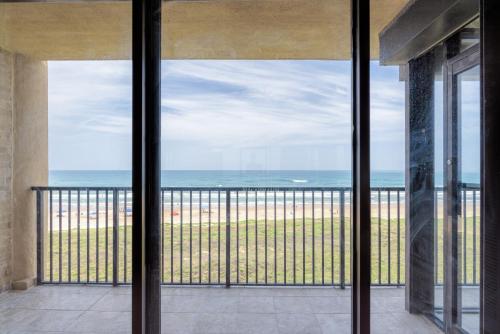 a view of the beach from the balcony of a house at Sea Vista in South Padre Island