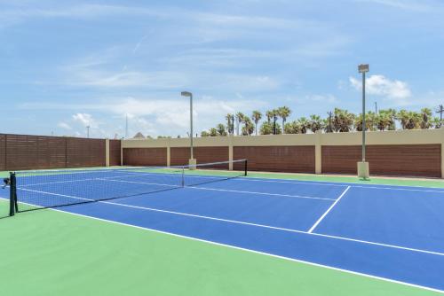 a tennis court with two tennis nets on it at Sea Vista in South Padre Island