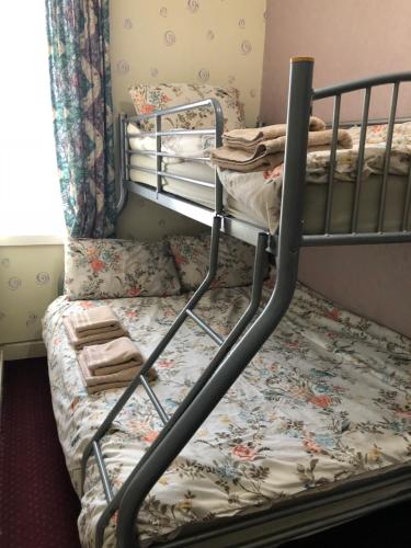 a bunk bed in a small room with a bed frame at Pier View b&b for families in Blackpool