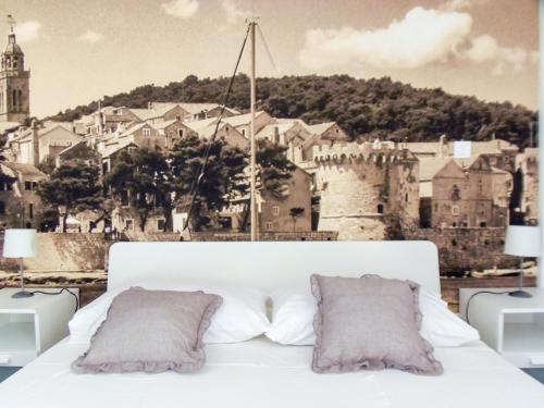 Ένα ή περισσότερα κρεβάτια σε δωμάτιο στο Villa Nobilo