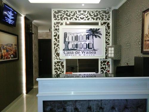 Televisyen dan/atau pusat hiburan di Casa de Wanea Hotel