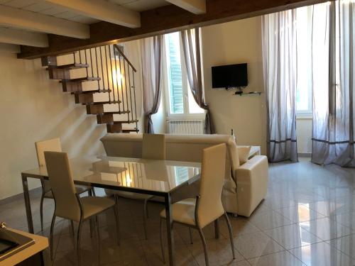 a dining room with a table and chairs at ABCdecor Italia in Imperia