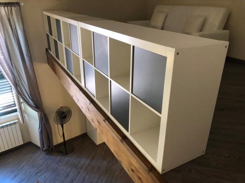 a loft bed with glass shelves in a room at ABCdecor Italia in Imperia