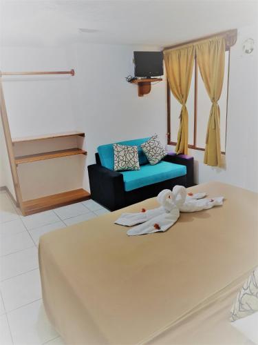 Cama o camas de una habitación en Galapagos Verde Azul