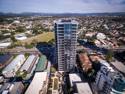 an overhead view of a city with a tall building at Boardwalk Burleigh Beach - Official in Gold Coast