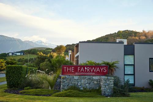 a sign in front of a building at The Fairways Accommodation Kaikoura in Kaikoura