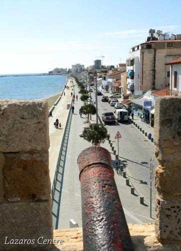 a view of the beach from a building at Lazaros Centre Apartment in Larnaka