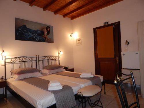 Posteľ alebo postele v izbe v ubytovaní Nisiotiko house in Tinos near the beach