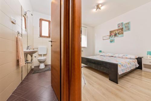 Postel nebo postele na pokoji v ubytování Apartments Paulino