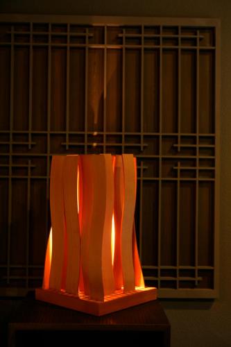 an orange and white object sitting on a table at Tabinoyado Ushionoakari Geiboso in Shima