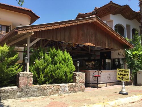 a building with a sign in front of it at Üstün Apart in Marmaris