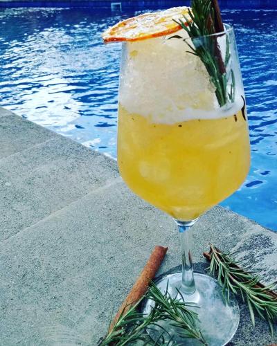 a drink in a glass next to a pool at Tiki bar and more in Nusa Lembongan