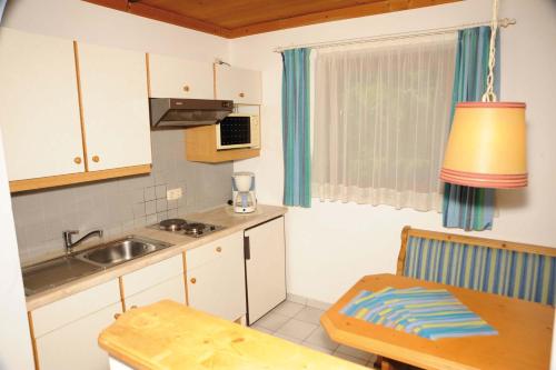 Кухня или мини-кухня в All Inclusive - Marco Polo Alpina Familien- & Sporthotel
