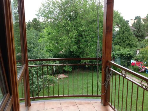 a balcony with a view of a yard at King Apartman in Sárvár