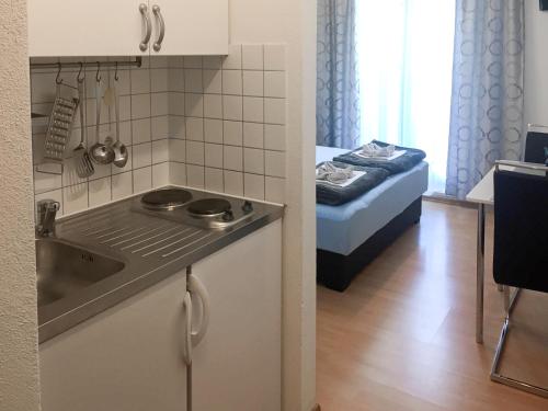 En eller flere senger på et rom på Apartments Logos