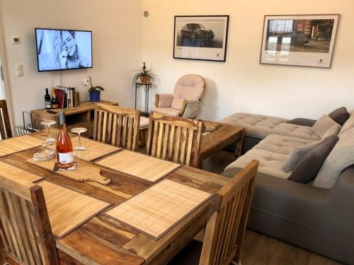 a living room with a table and a couch at Riesling House Laa in Laa an der Thaya