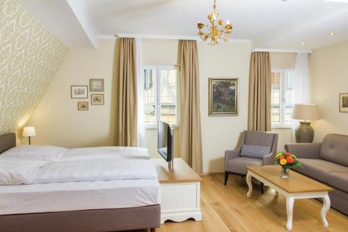 Ένα ή περισσότερα κρεβάτια σε δωμάτιο στο Hotel Reichsküchenmeister