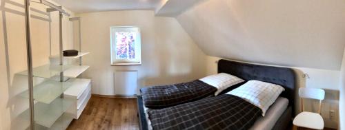 a living room with a couch and two pillows at Casa Meloni in Bad Sachsa
