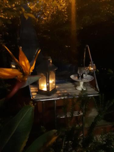 a table with a lantern and a candle on it at B&B La Villetta Palese in Bari