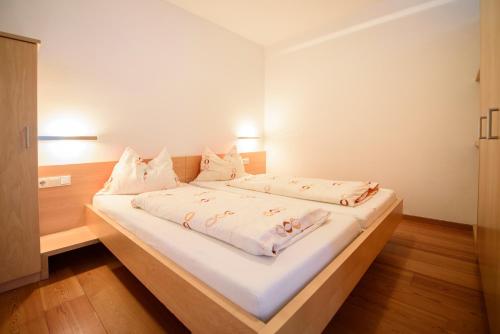 Llit o llits en una habitació de Arboris Appartement