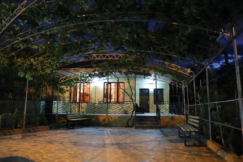 an entrance to a building at night at Papazo in Kutaisi