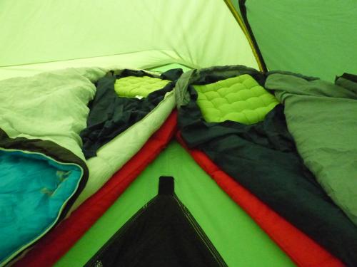 a pile of clothes laying on top of a tent at dtente sky lodge in Massat