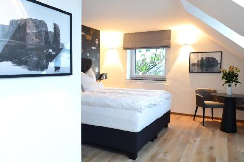 Postel nebo postele na pokoji v ubytování Haus Sathurn