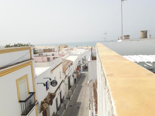 an overhead view of a city street with buildings at CH II Apartments ZONA DE OCIO NOCTURNO in Conil de la Frontera