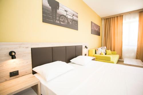 Aparthotel & Spa KASMIにあるベッド