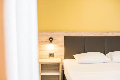 Aparthotel & Spa KASMIにあるベッド