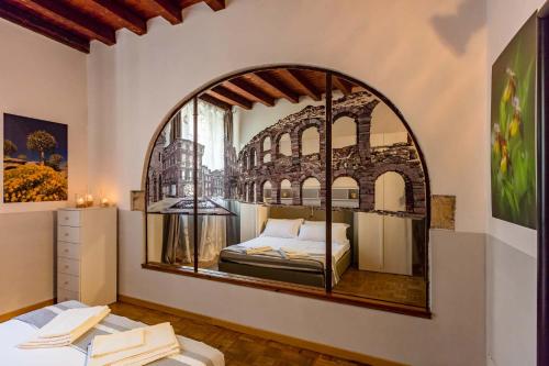 Tempat tidur dalam kamar di Residence Casanova Duomo