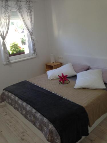 Una cama o camas en una habitación de Aparthotel Pr' Jakapč'